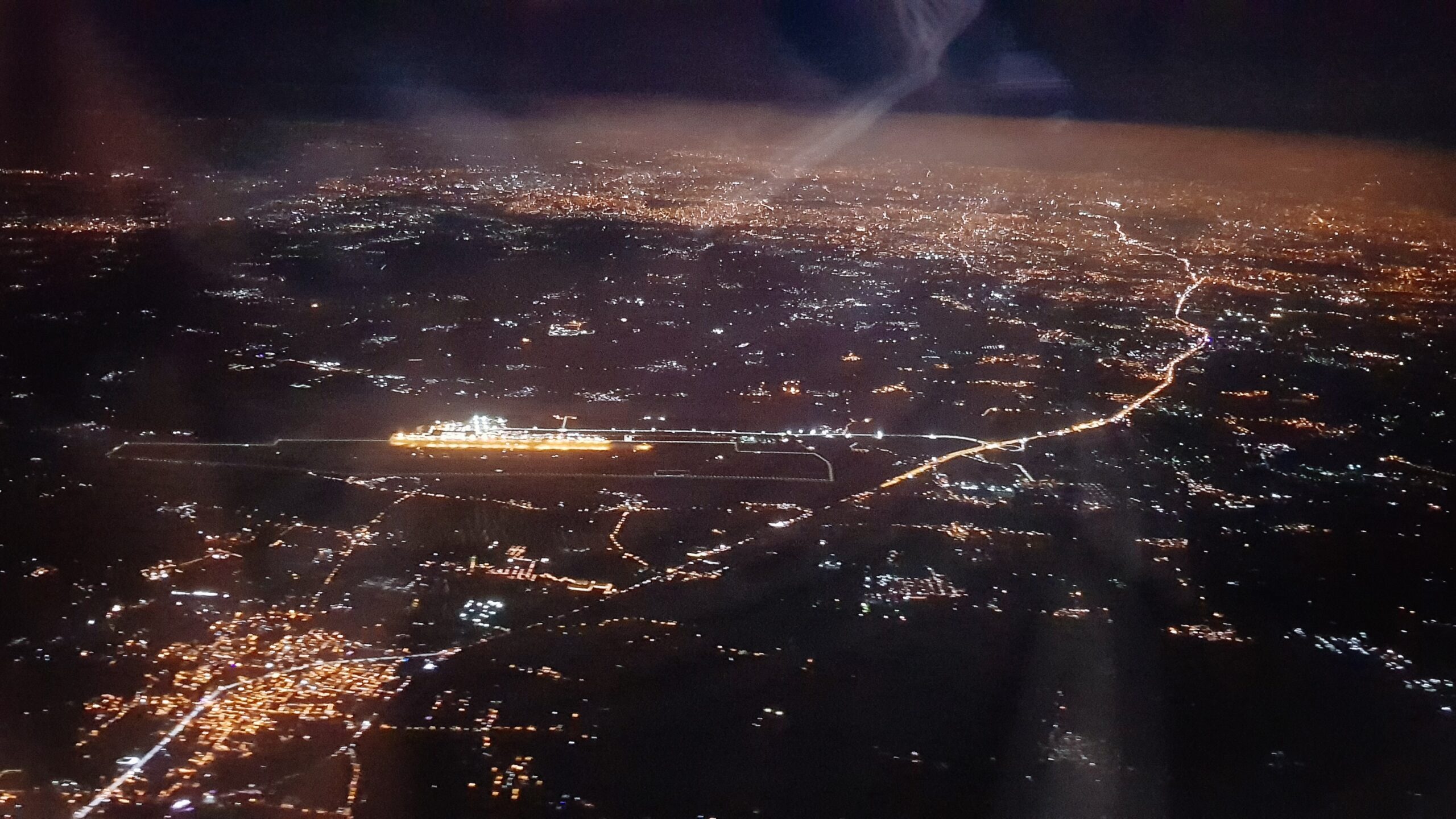A visual of Bengaluru city, taken during a landing from inside an aircraft.