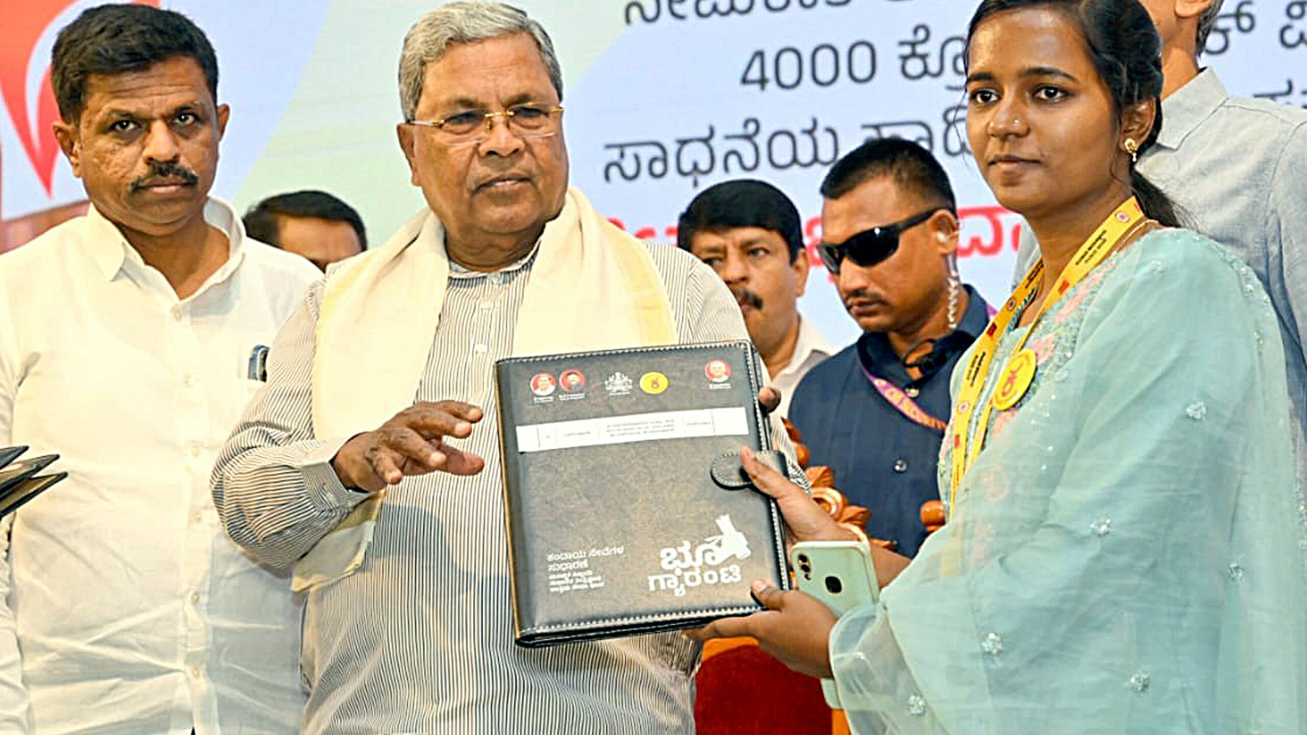 Chief Minister Siddaramaiah launching the grassroots governance programme and equipping the newly appointed VAOs.