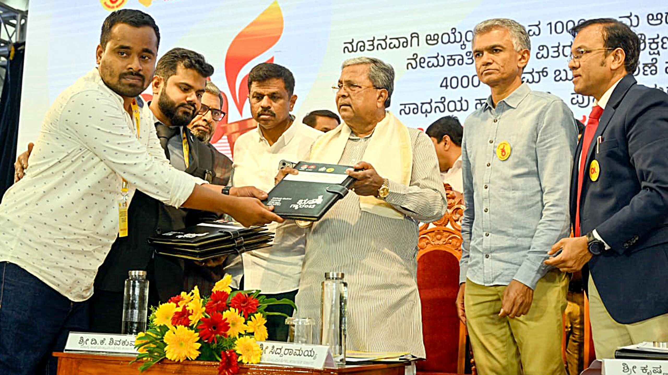 Chief Minister Siddaramaiah launching the grassroots governance programme and equipping the newly appointed VAOs.