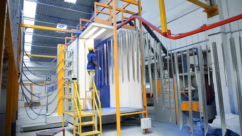 An image of a worker at Supreme Solar's factory.