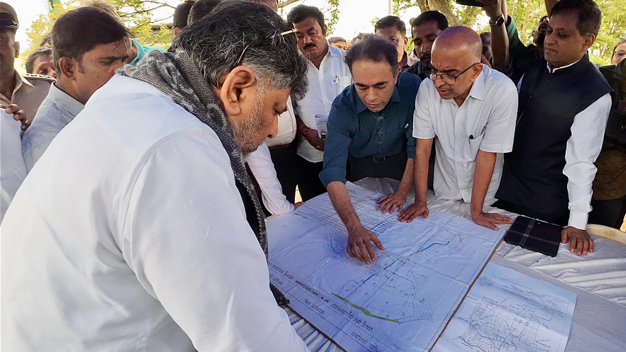 Karnataka Deputy Chief Minister DK Shivakumar inspecting flood-affected areas of Bengaluru along with senior officials.