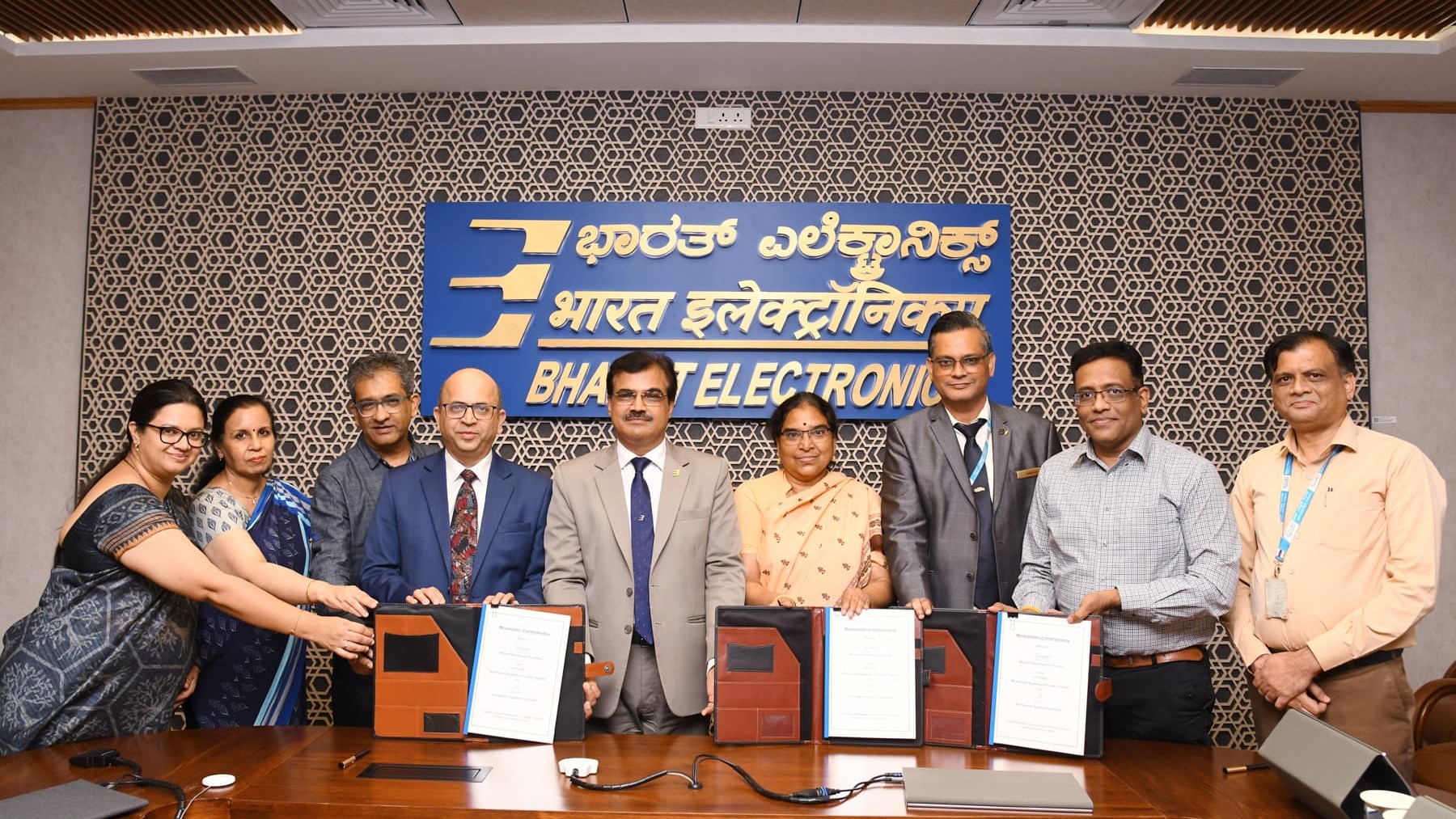 Managements of BEL and the two other firms signing an MoU for collaboration on AI-driven solutions.