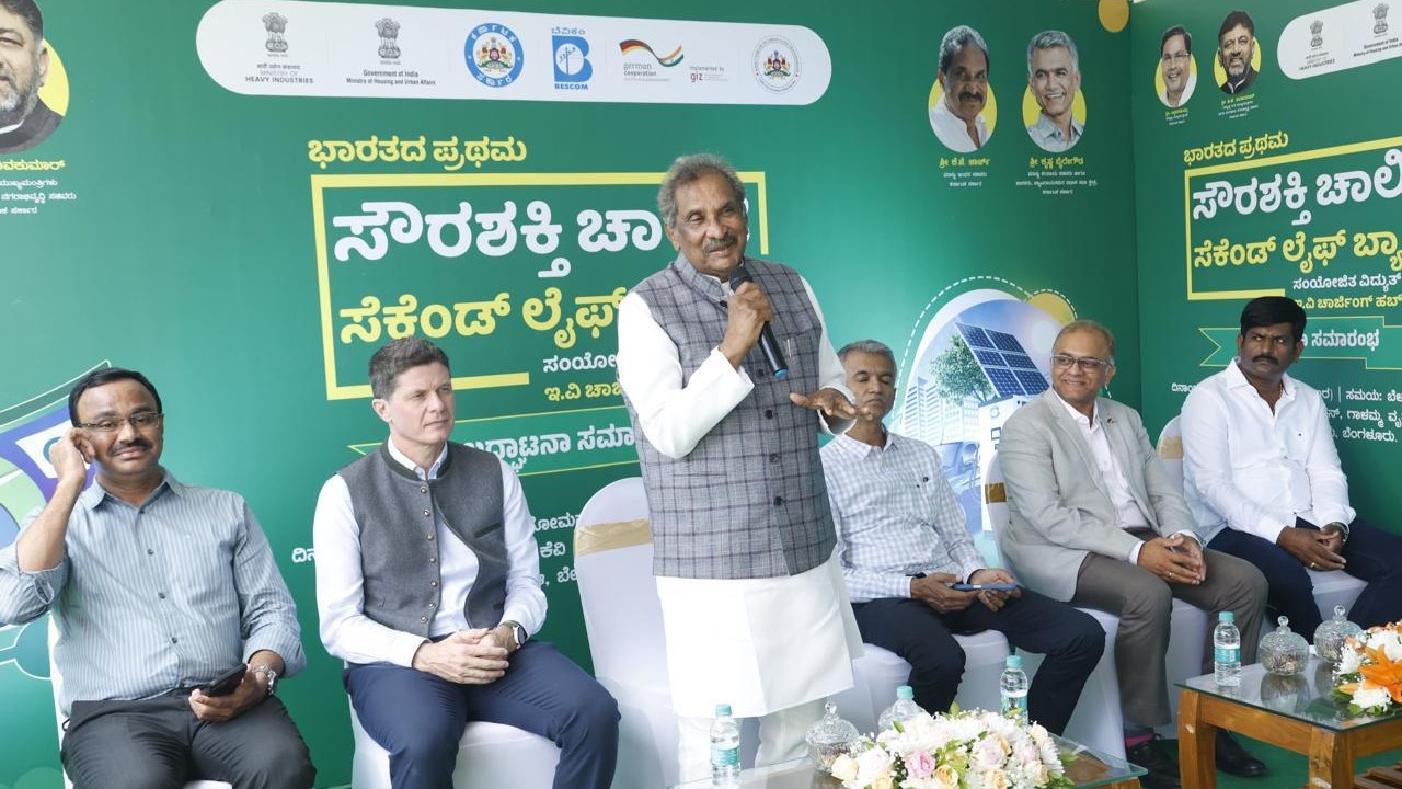 Energy Minister KJ George unveiling the charging station at BIAL.