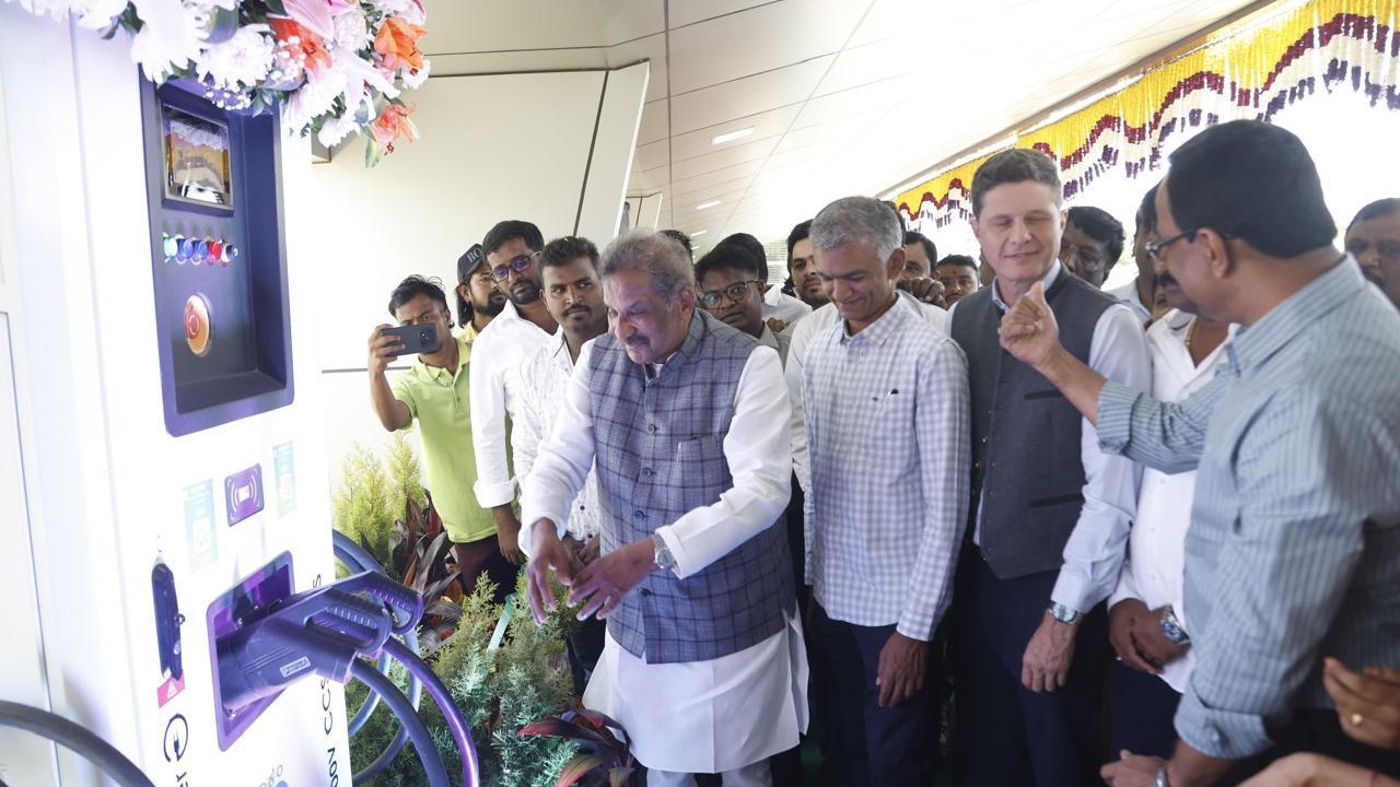 Energy Minister KJ George unveiling the charging station at BIAL.