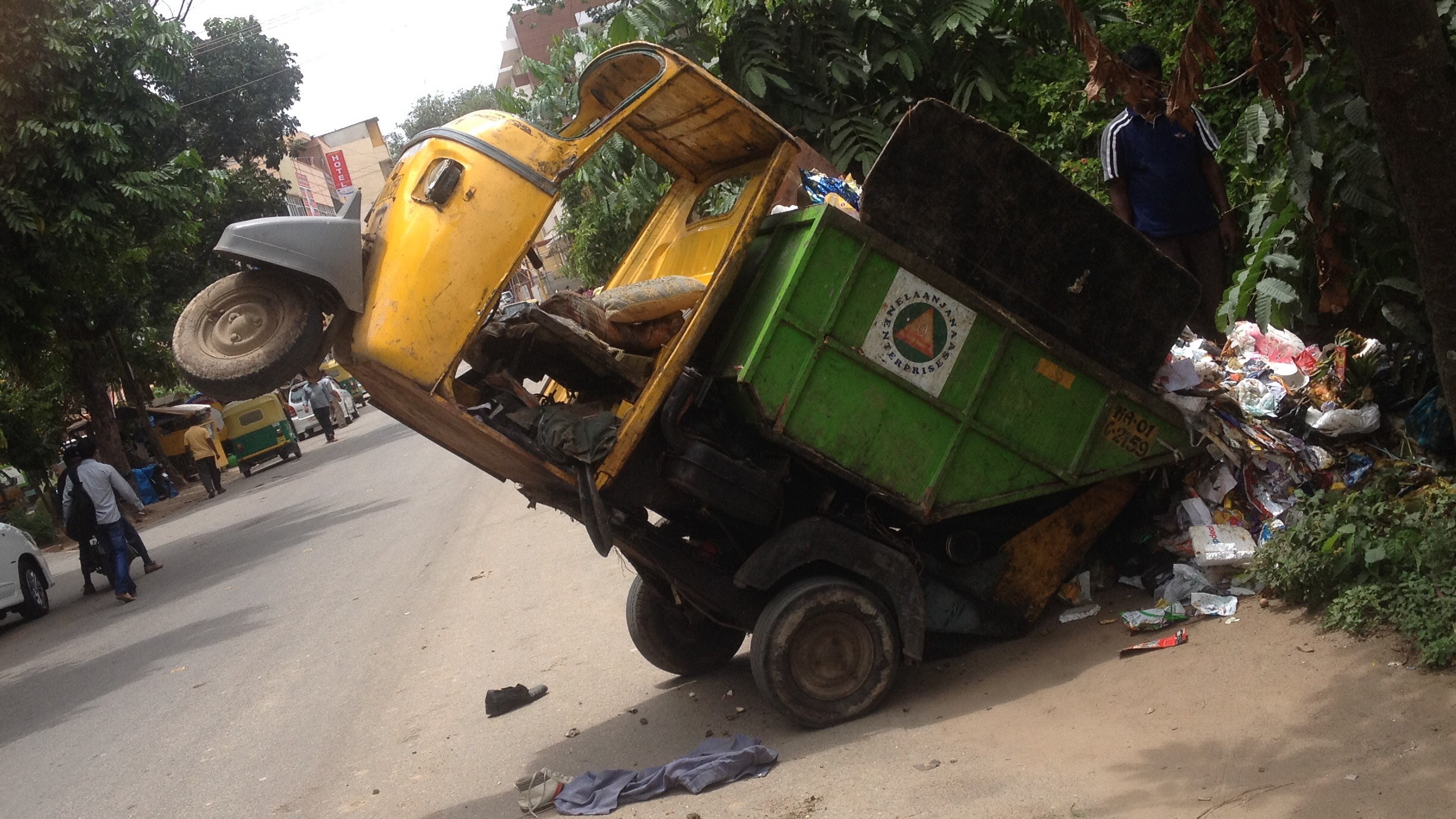 A tipper auto dumping trash in Bengaluru. - File photo.