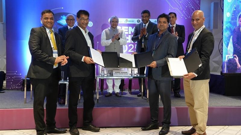 Leaderships of L&T and IISc displaying the Memorandum of Understanding at Semicon 2025 in Mumbai.
