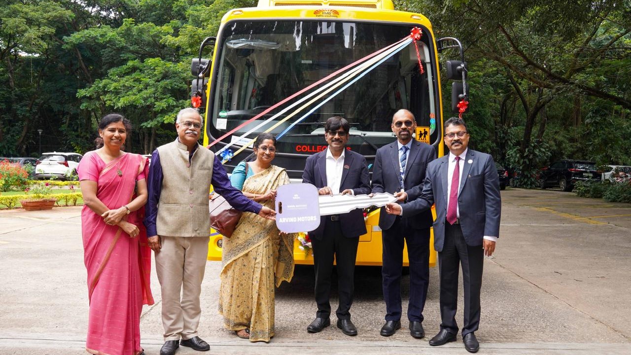 Senior functionaries of IIM-B, NeSL and Canara Bank unveiling the electric bus commissioned by the institute for mobility within campus.