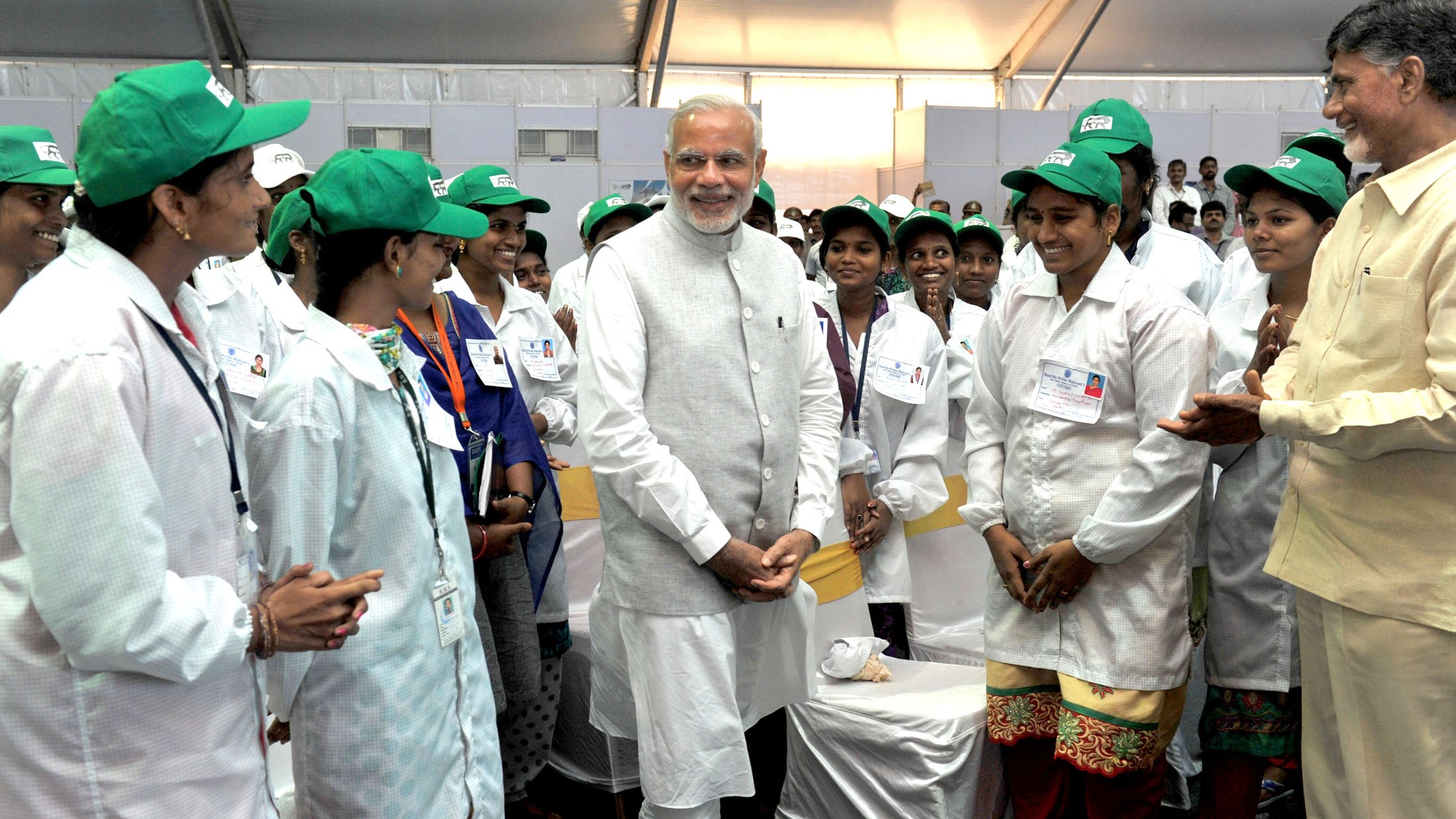 Prime Minister Narendra Modi interacts with workers at a factory in Andhra Pradesh. — File picture for representation only.