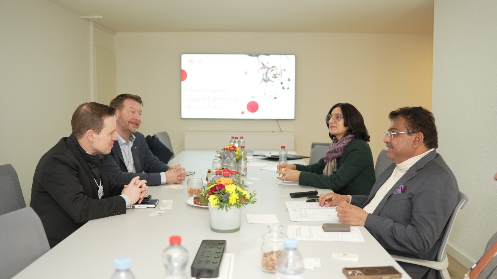 Karnataka Industries Minister M B Patil and officials in discussions with business leaders in Davos.