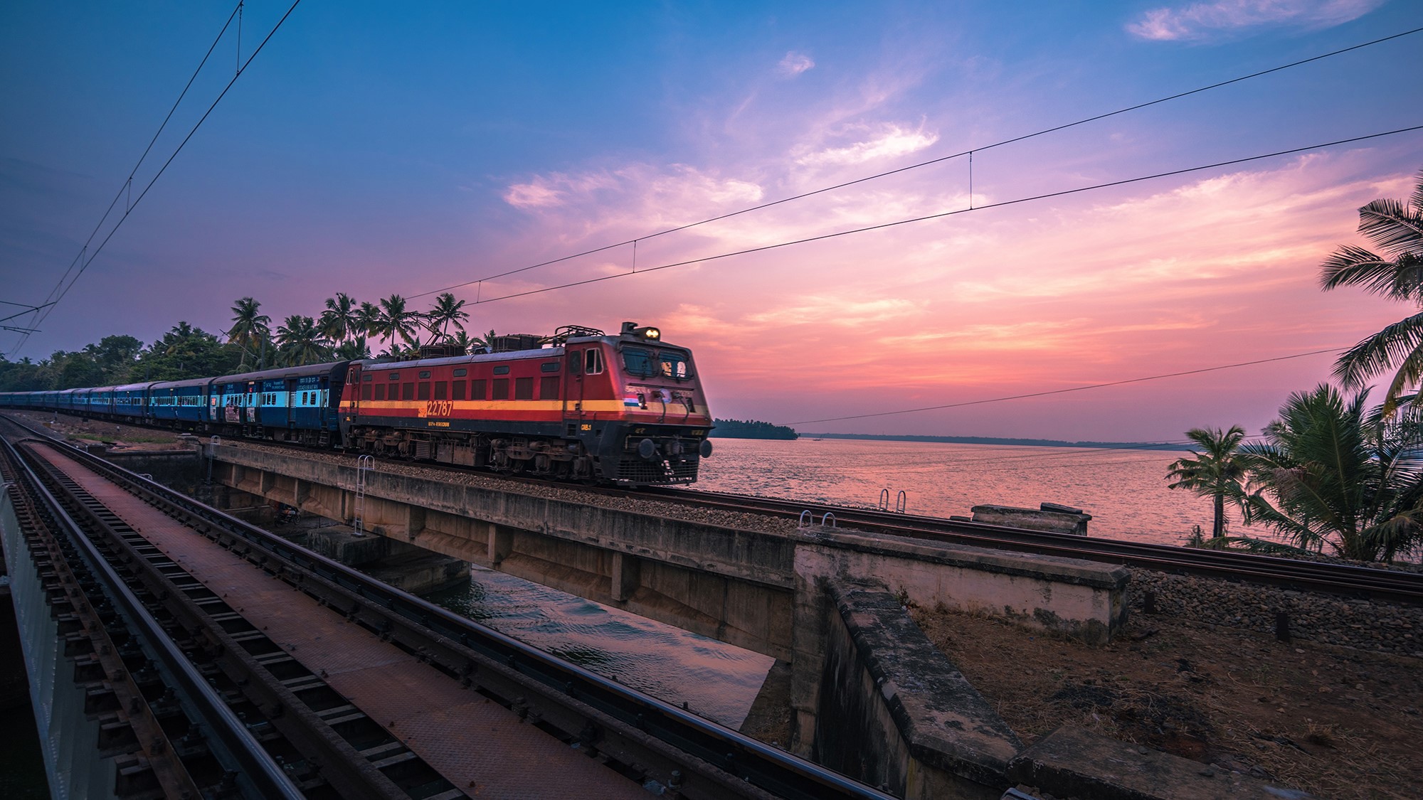 A train chugging along the Peruman bridge in Kerala.