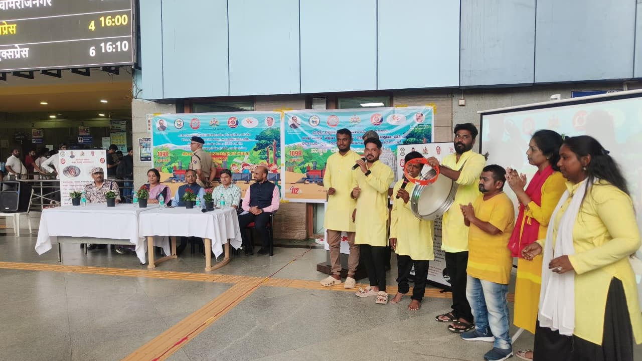 Officials and rail users during the awareness programme at KSR Bengaluru station.
