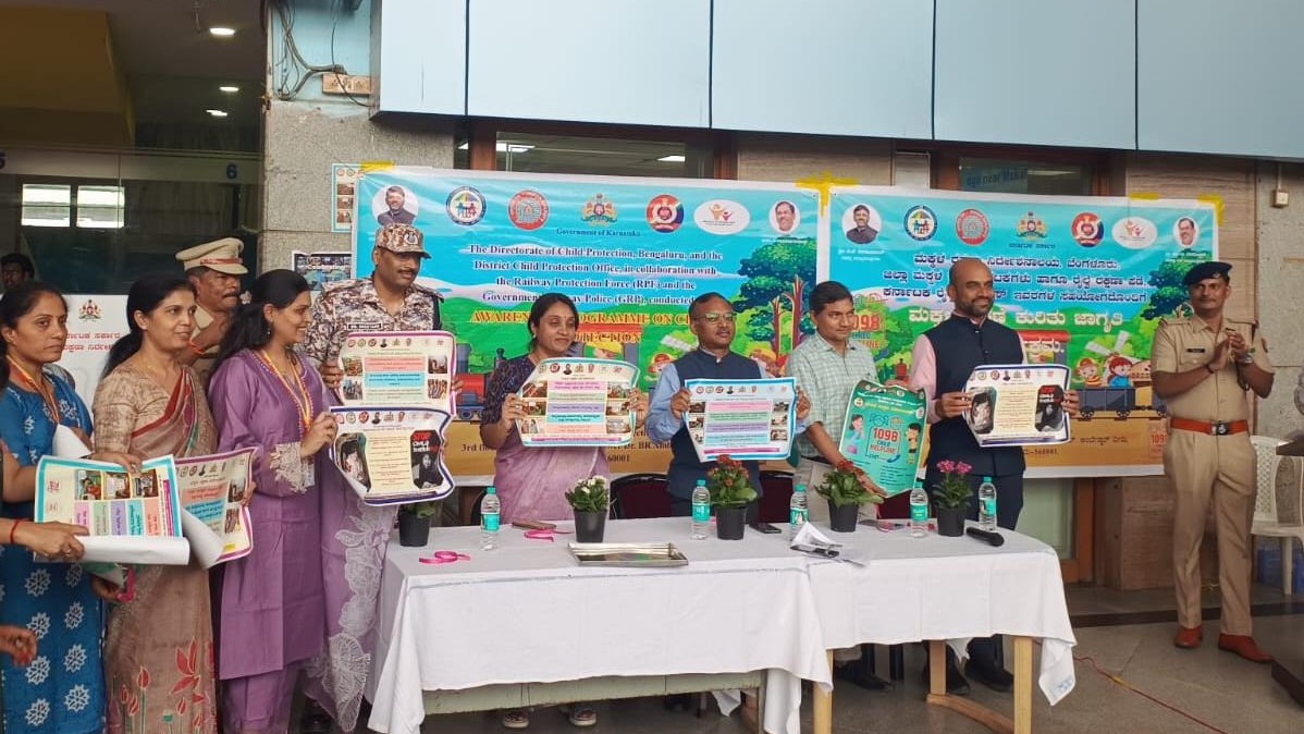 Officials and rail users during the awareness programme at KSR Bengaluru station.